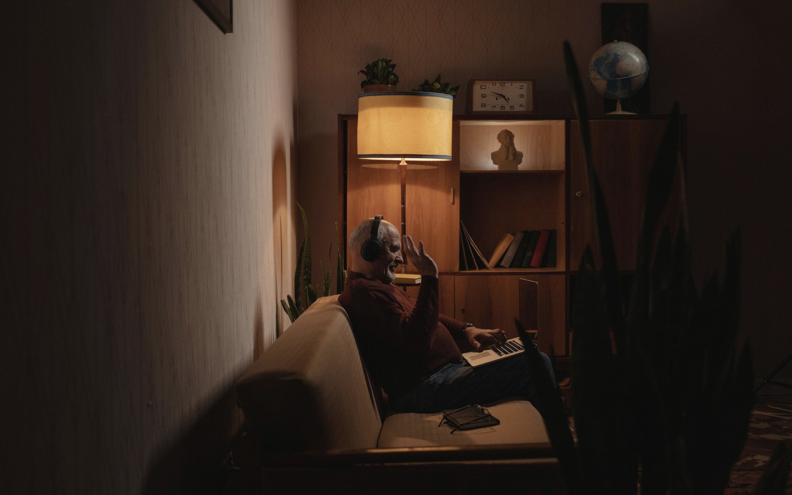A man on a video call at home in the evening